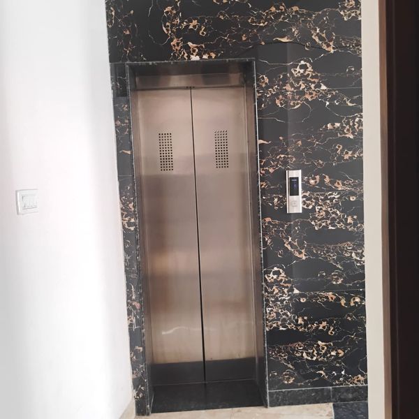 Premium elevator passenger lift lobby at Radha Raman Residency